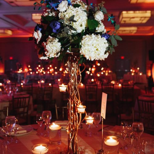 Tender hydrangea centerpiece on the round table with lightening candles